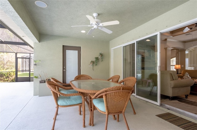 dining room with ceiling fan, plenty of natural light, and a textured ceiling