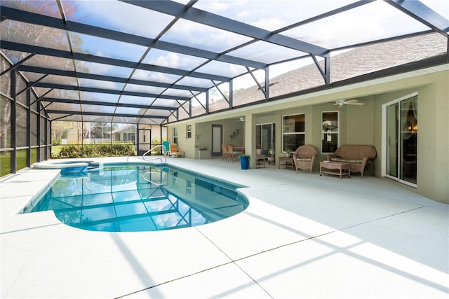 view of swimming pool featuring a lanai, outdoor lounge area, ceiling fan, and a patio area