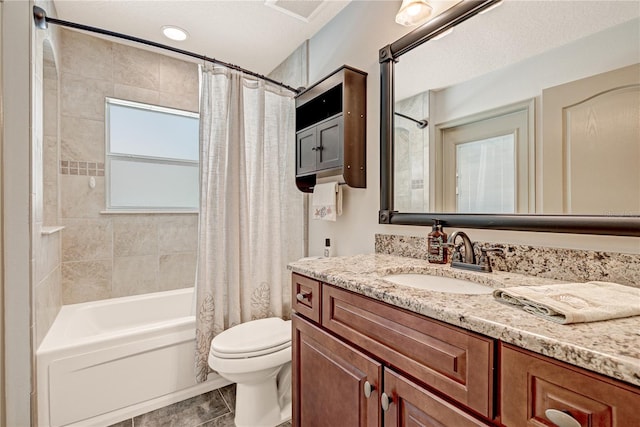 full bathroom with vanity, toilet, tile patterned flooring, and shower / bath combo