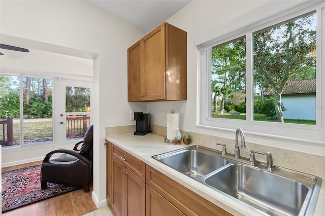 kitchen with a healthy amount of sunlight, sink, and ceiling fan