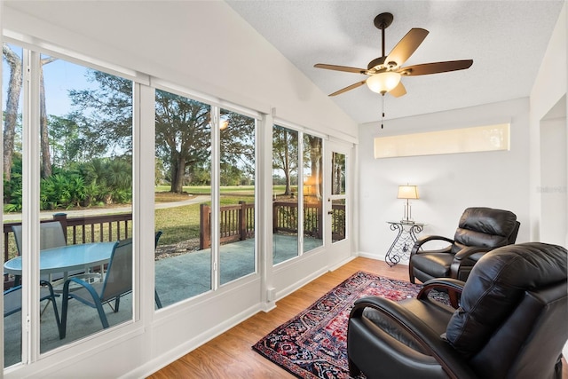 sunroom / solarium featuring vaulted ceiling and ceiling fan