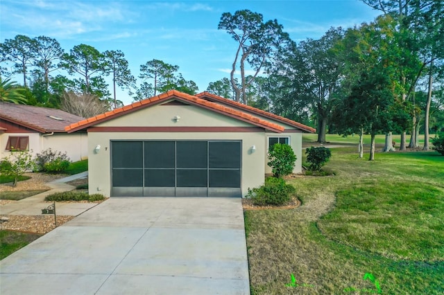 view of front facade with a garage and a front lawn