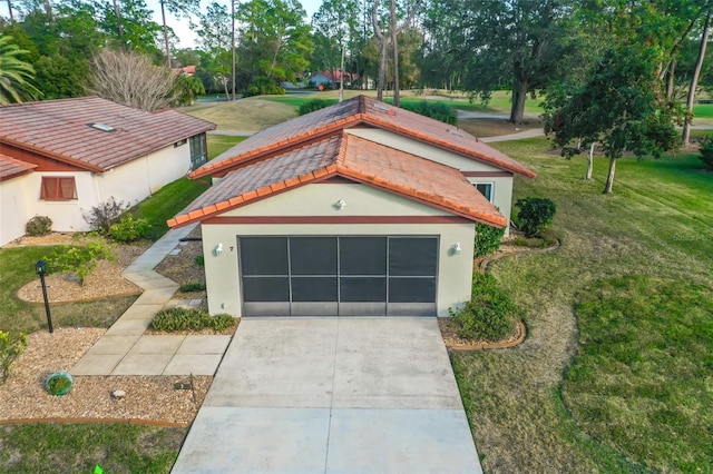 view of front of house with a garage and a front yard