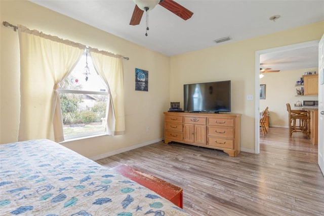 bedroom featuring ceiling fan and light wood-type flooring