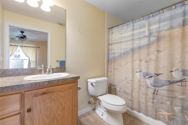 bathroom featuring ceiling fan, vanity, a shower with curtain, tile patterned floors, and toilet