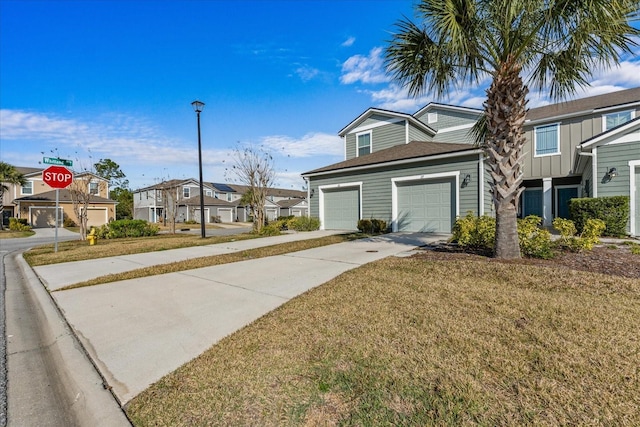 view of front of house with a garage and a front lawn