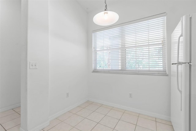 empty room featuring light tile patterned floors