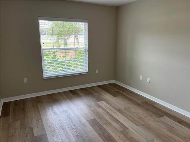 spare room with light hardwood / wood-style floors