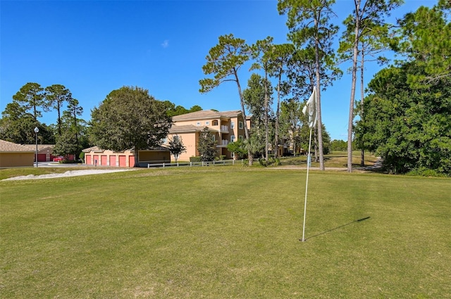 view of property's community featuring a lawn