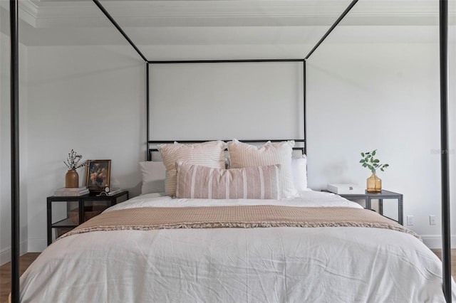 bedroom with hardwood / wood-style floors