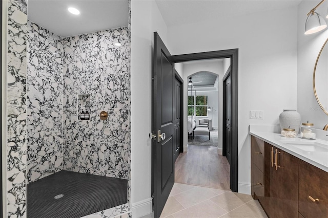 bathroom with vanity, tile patterned floors, and tiled shower