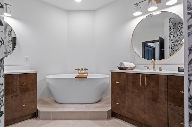 bathroom featuring vanity and a tub