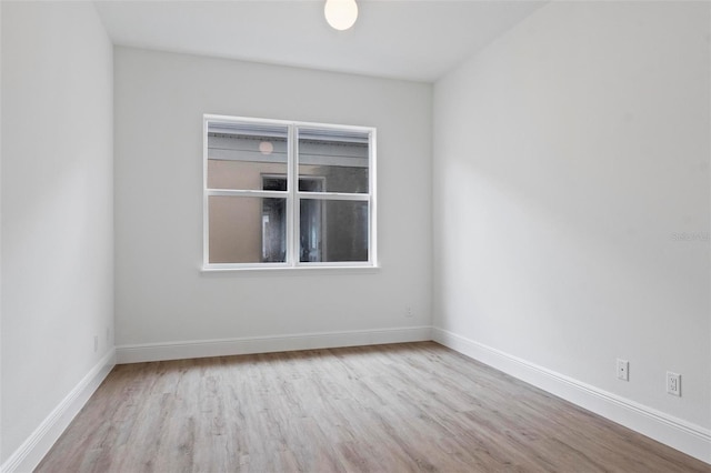 unfurnished room with light hardwood / wood-style floors