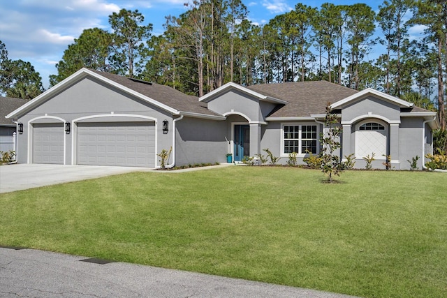 ranch-style home featuring a garage and a front lawn