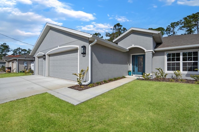 ranch-style house featuring a garage and a front yard