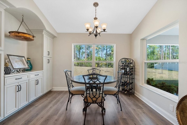 dining room featuring lofted ceiling, a wealth of natural light, and light wood-type flooring