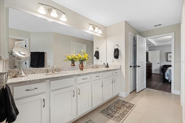 bathroom with vanity and tile patterned flooring