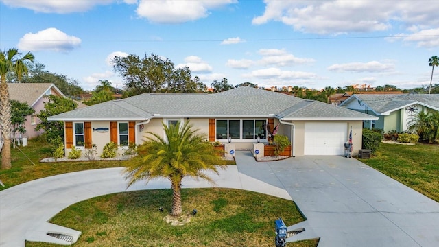 ranch-style home with a garage and a front yard