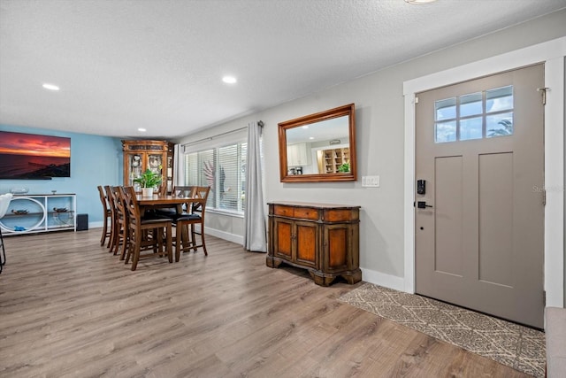 15 Cloverdale Ct S, Palm Coast, FL 32137 - dining room featuring wood finished floors, baseboards, recessed lighting, and a textured ceiling