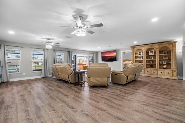 15 Cloverdale Ct S, Palm Coast, FL 32137 - living area featuring wood finished floors, plenty of natural light, a ceiling fan, and recessed lighting