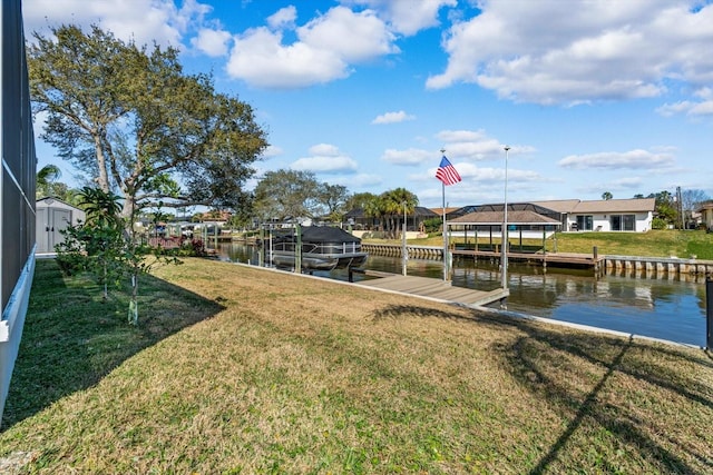 15 Cloverdale Ct S, Palm Coast, FL 32137 - dock with a water view, a residential view, and a yard