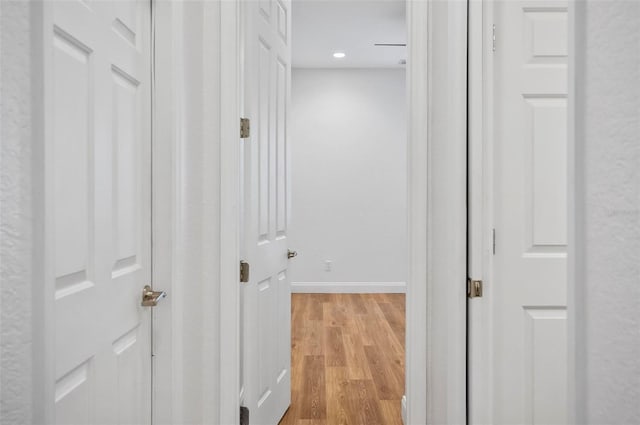 corridor featuring light hardwood / wood-style floors