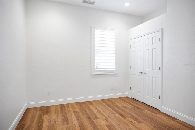 spare room featuring hardwood / wood-style floors