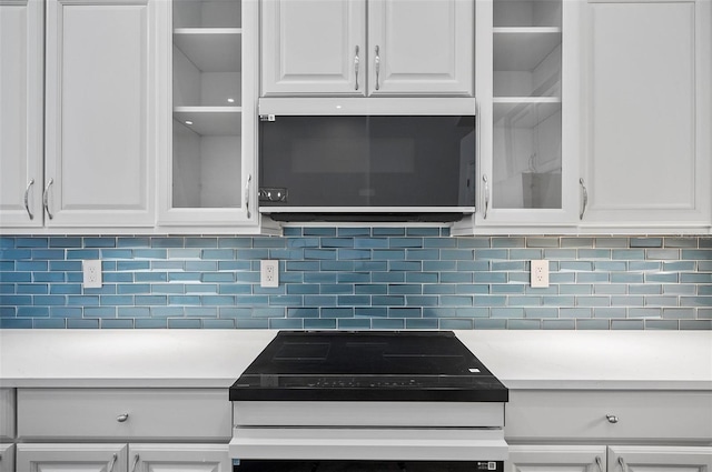 kitchen with white cabinetry and decorative backsplash