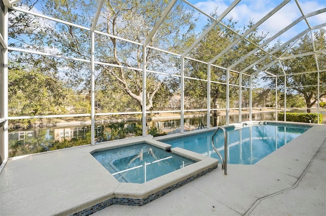 view of swimming pool with a water view, a patio, an in ground hot tub, and glass enclosure