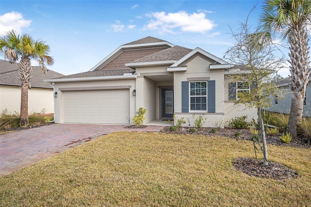 view of front of house featuring a garage and a front yard