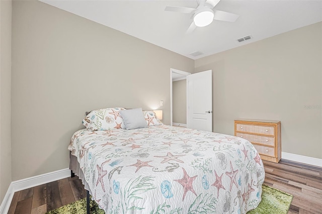 bedroom featuring hardwood / wood-style floors and ceiling fan