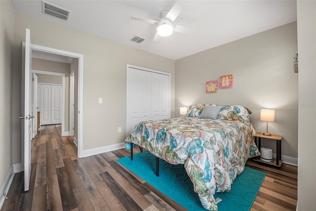 bedroom with dark wood-type flooring, a closet, and ceiling fan