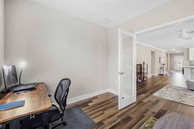 home office featuring crown molding, ceiling fan, and dark hardwood / wood-style flooring