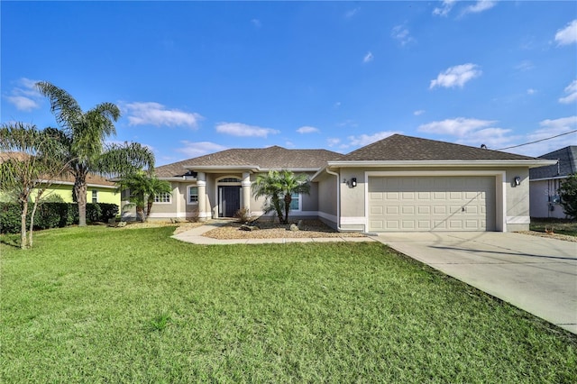 view of front of home with a garage and a front yard