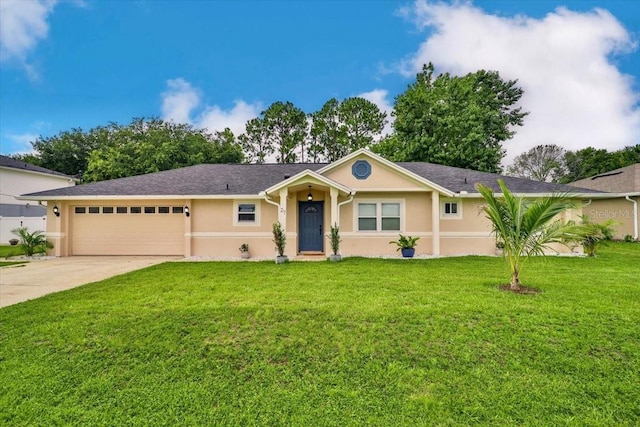 single story home with a garage and a front lawn