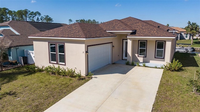 view of front facade with a garage and a front yard