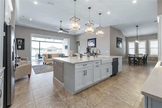 kitchen featuring white cabinetry, pendant lighting, a kitchen island with sink, and stainless steel refrigerator with ice dispenser