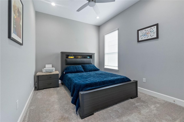 bedroom with light carpet and ceiling fan