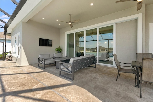 view of patio / terrace with ceiling fan and an outdoor living space