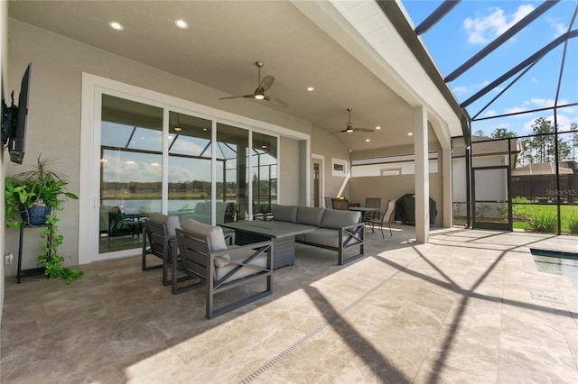 view of patio / terrace with outdoor lounge area, ceiling fan, and a lanai