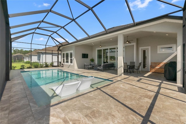 rear view of house featuring ceiling fan, a patio, an outdoor living space, and glass enclosure