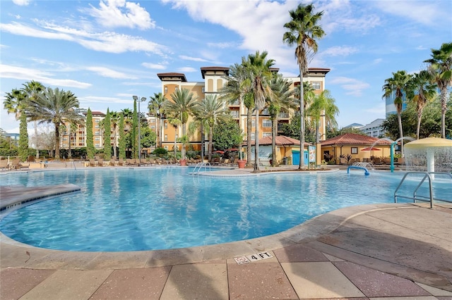 view of swimming pool featuring a patio area