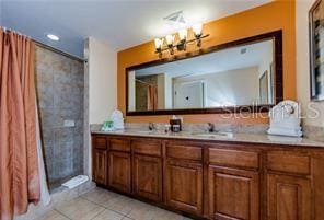 bathroom featuring vanity, tile patterned floors, and a shower with shower curtain