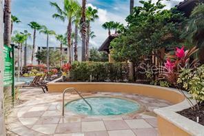 view of swimming pool featuring a patio and a community hot tub