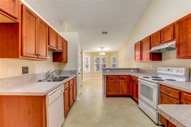 kitchen with sink, an inviting chandelier, a textured ceiling, pendant lighting, and white appliances