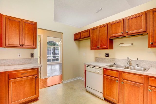 kitchen featuring sink and white dishwasher