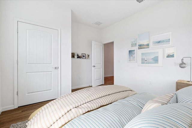 bedroom featuring dark wood-type flooring