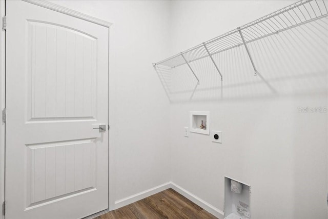 clothes washing area with washer hookup, dark hardwood / wood-style flooring, and hookup for an electric dryer