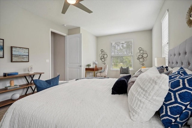 bedroom with hardwood / wood-style flooring and ceiling fan