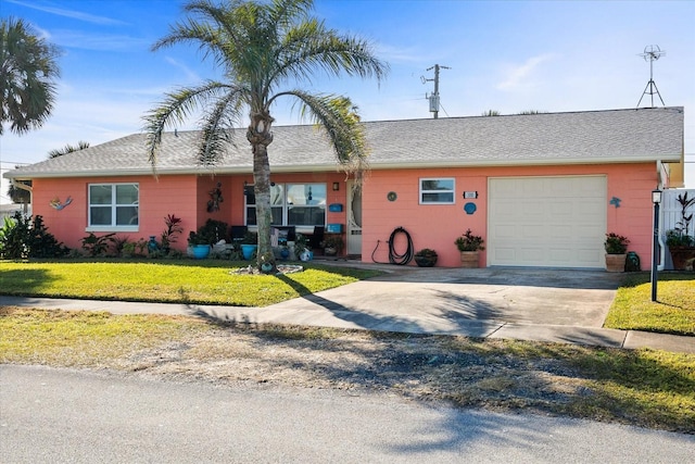 single story home with a garage and a front yard